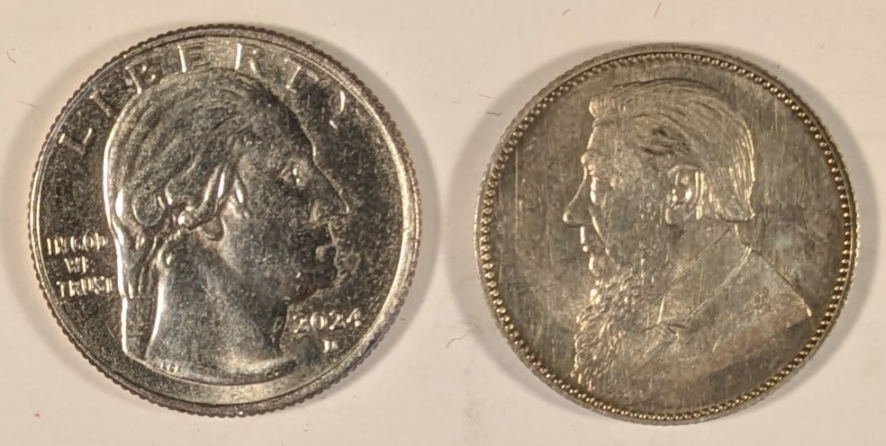 SOUTH AFRICA, Zuid Afrikaansche Republik ~ 1897 ~ Shilling ~ Bust of Paul Kruger left ~ Value divides date in wreath, Z. AFRIK. REP. above. ~ Y-4, KM-5 ~ Nice unc., a few marks