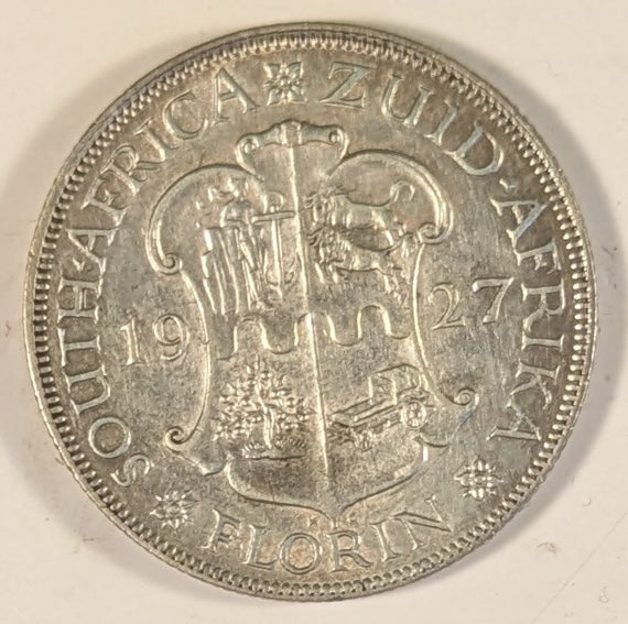 SOUTH AFRICA, Union of So. Africa, Dominion ~ 1927 ~ 1 Florin ~ Crowned bust of George V left ~ Arms divides date. Denomination as FLORIN. ~ Y-20, KM-18 ~ VF/EF