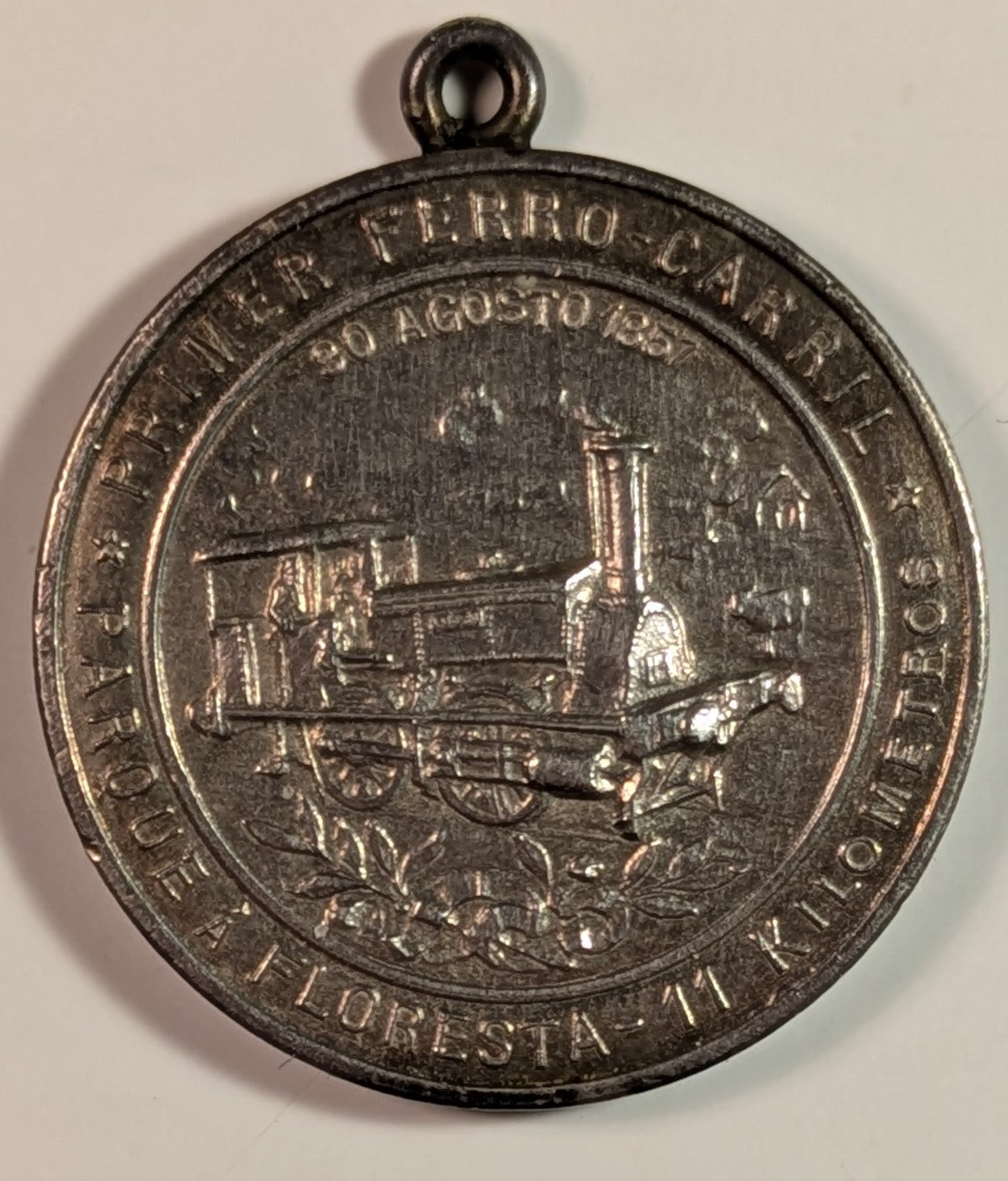 ARGENTINA, 50th anniversary 1st railroad Parque to Floresta, 1907 ~ Silvered AE31mm, looped as made ~ Steam engine in center, legend around ~ Allegorical figures, train in background, legend around ~ As Swan-539 ~ EF