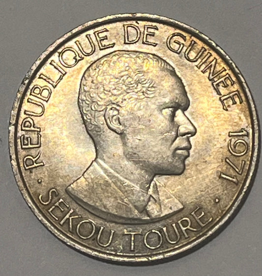 GUINEA, Republic ~ 1971 ~ 100 Francs ~ One year type. Head of Ahmed Sekou Toure ~ Not released for circulation. Scarce ~ Y-9, KM-41 ~ Toned Unc